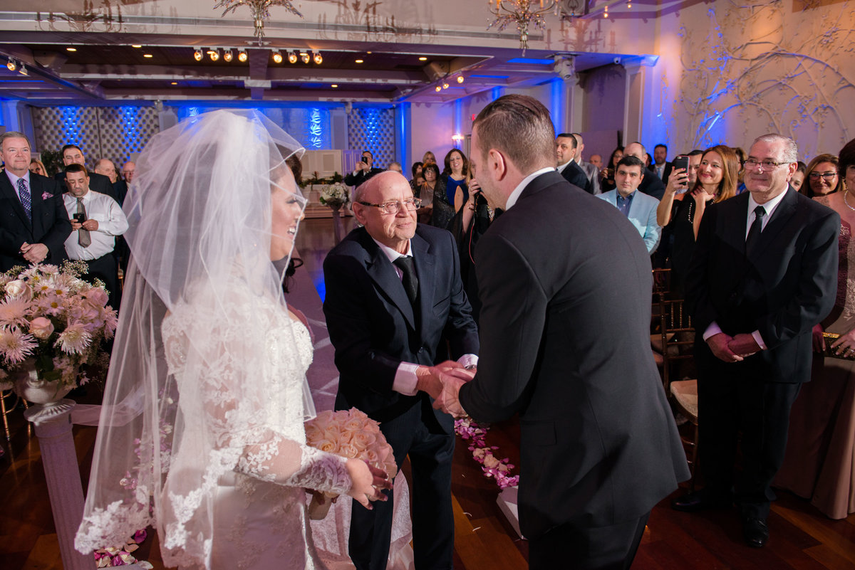 Groom shaking hands with bride's father at The Somerley