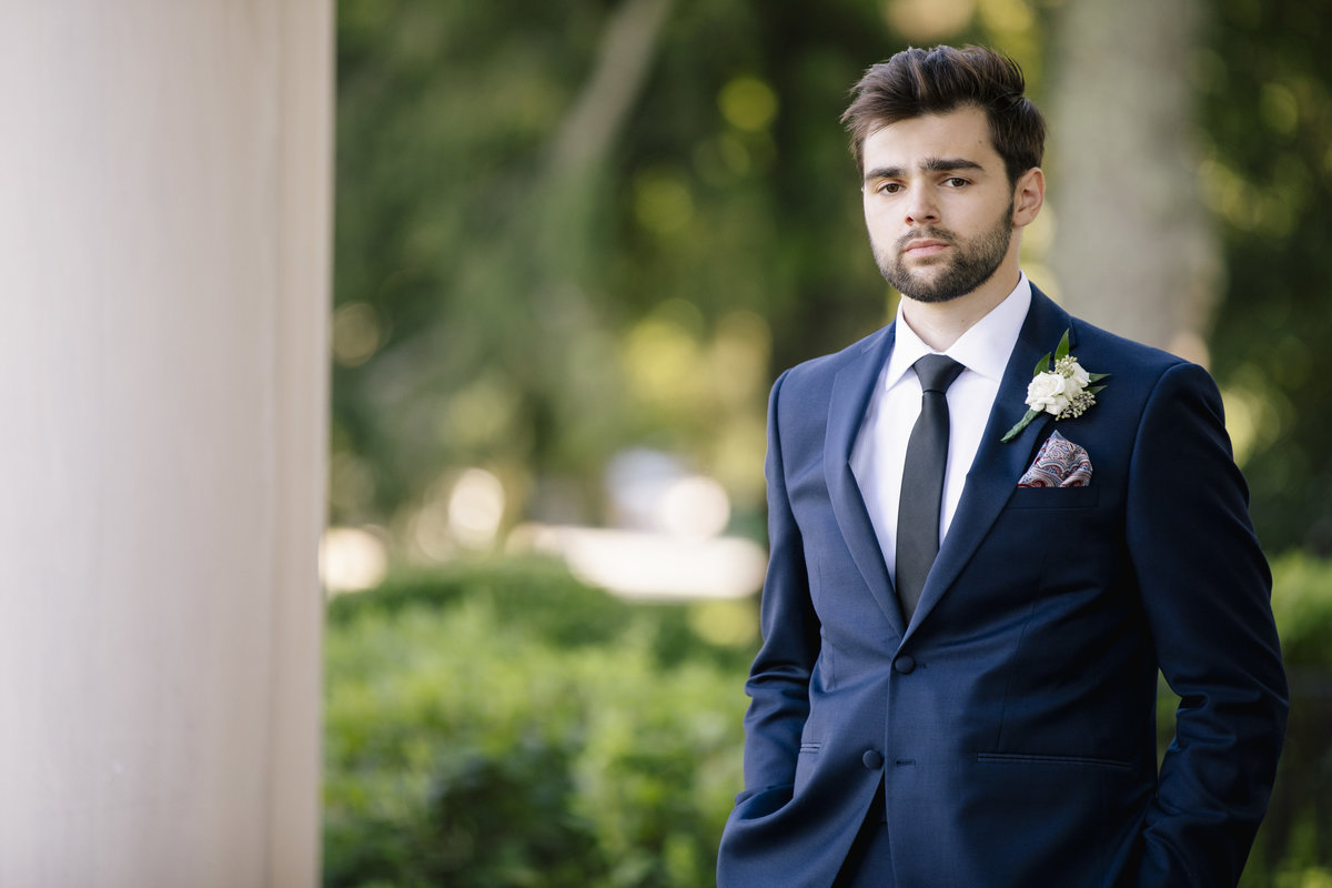 groom in thompson park before molly pitcher inn wedding