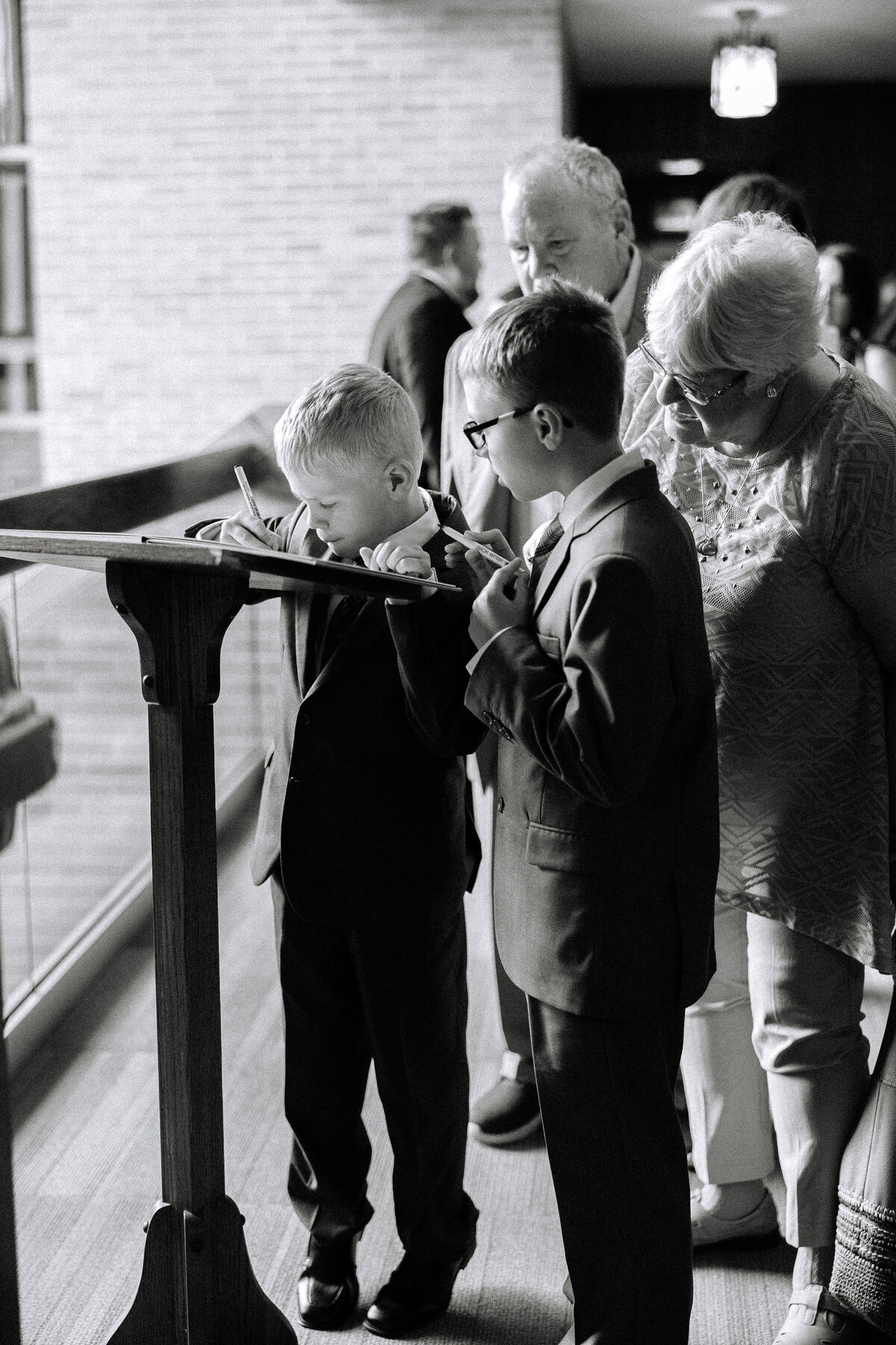 boy signing in at wedding ceremony-1
