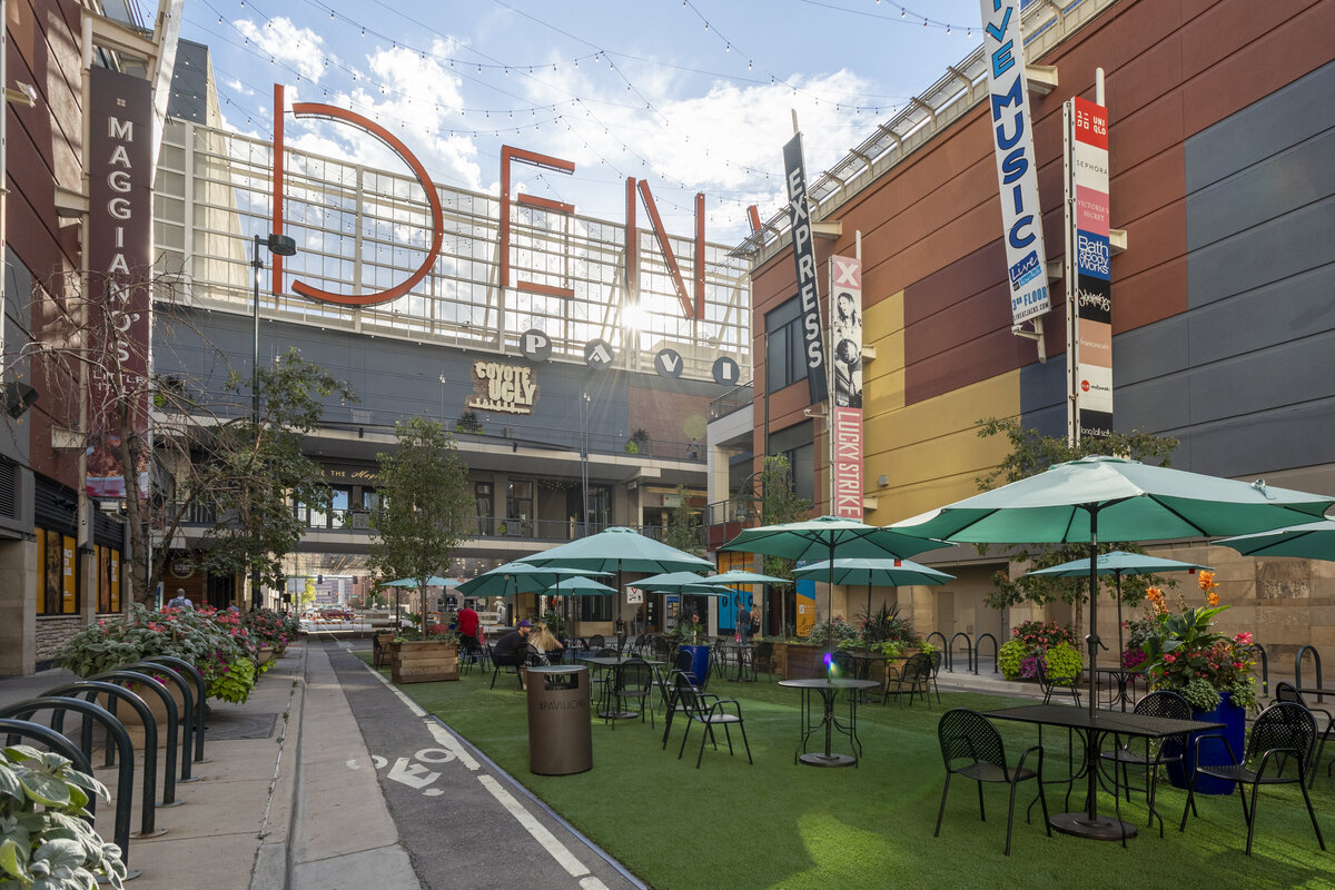 Denver Pavilions Downtown Denver off 16th Street Mall and Glenarm Place, Outdoor dining tables in summer.