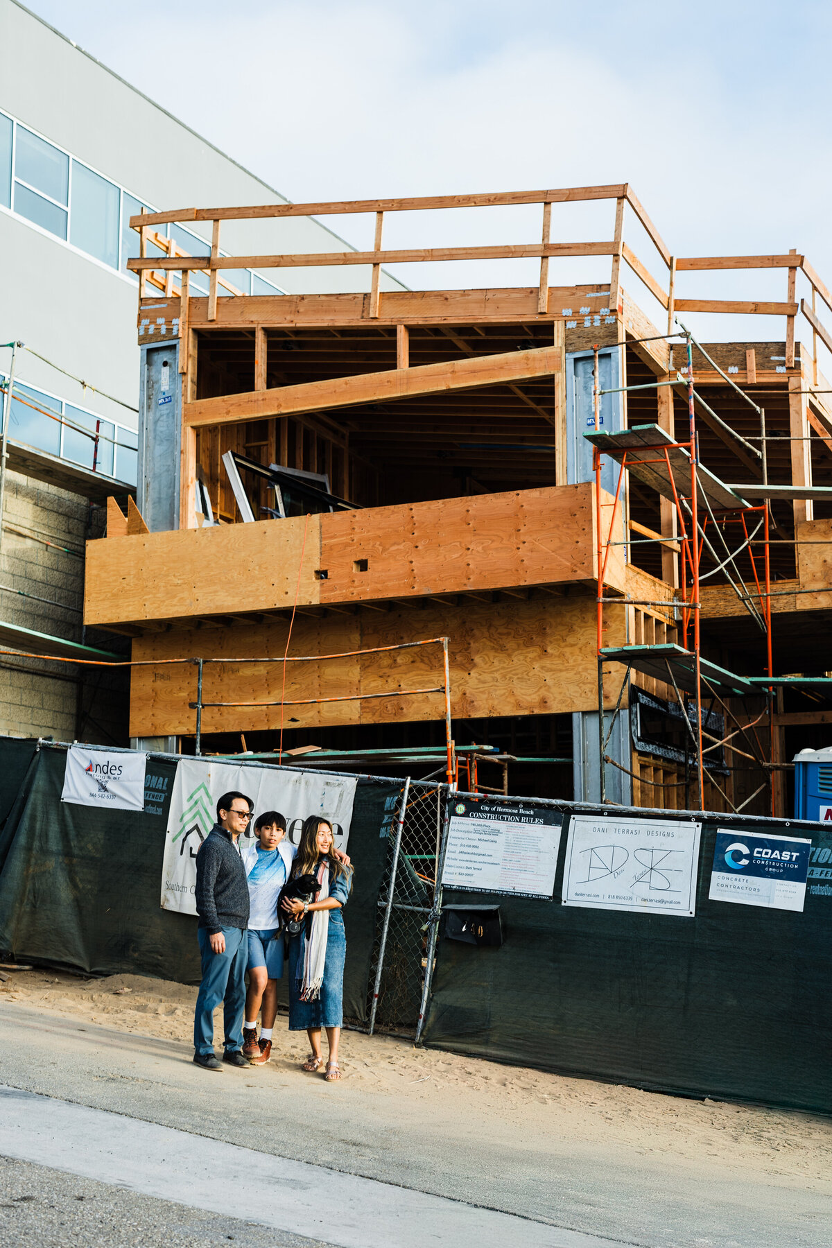 family-standing-in-front-of-their-los-angeles-home