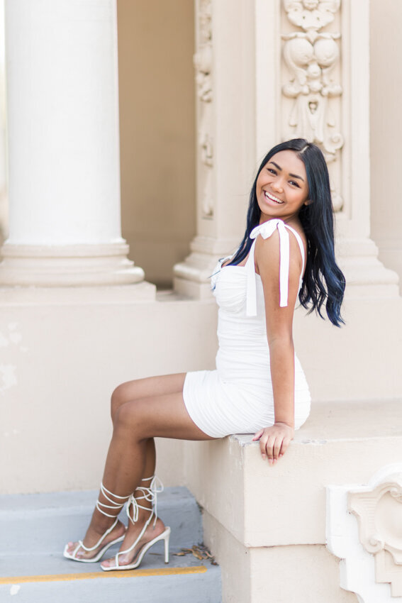 Senior girl sitting at organ pavillion San Diego