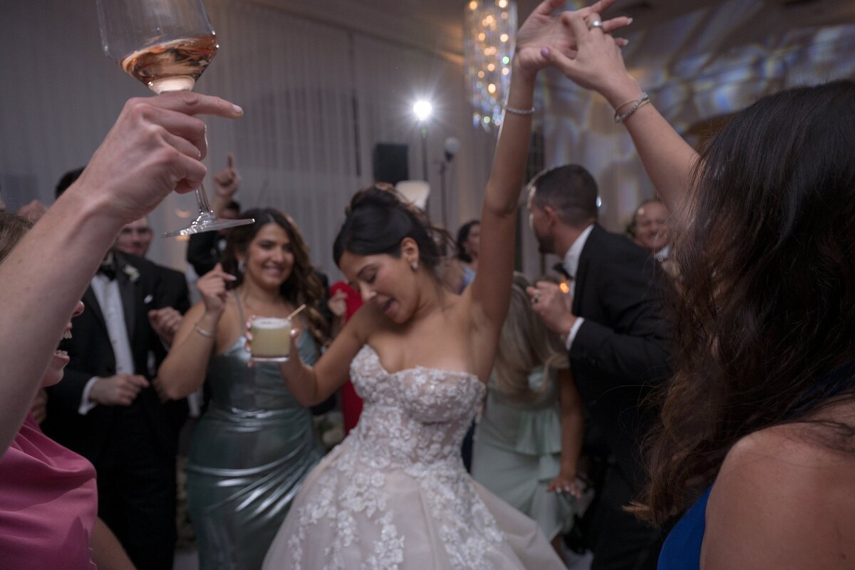 Guests enjoy the dance floor during wedding at Belle Mer Newport.