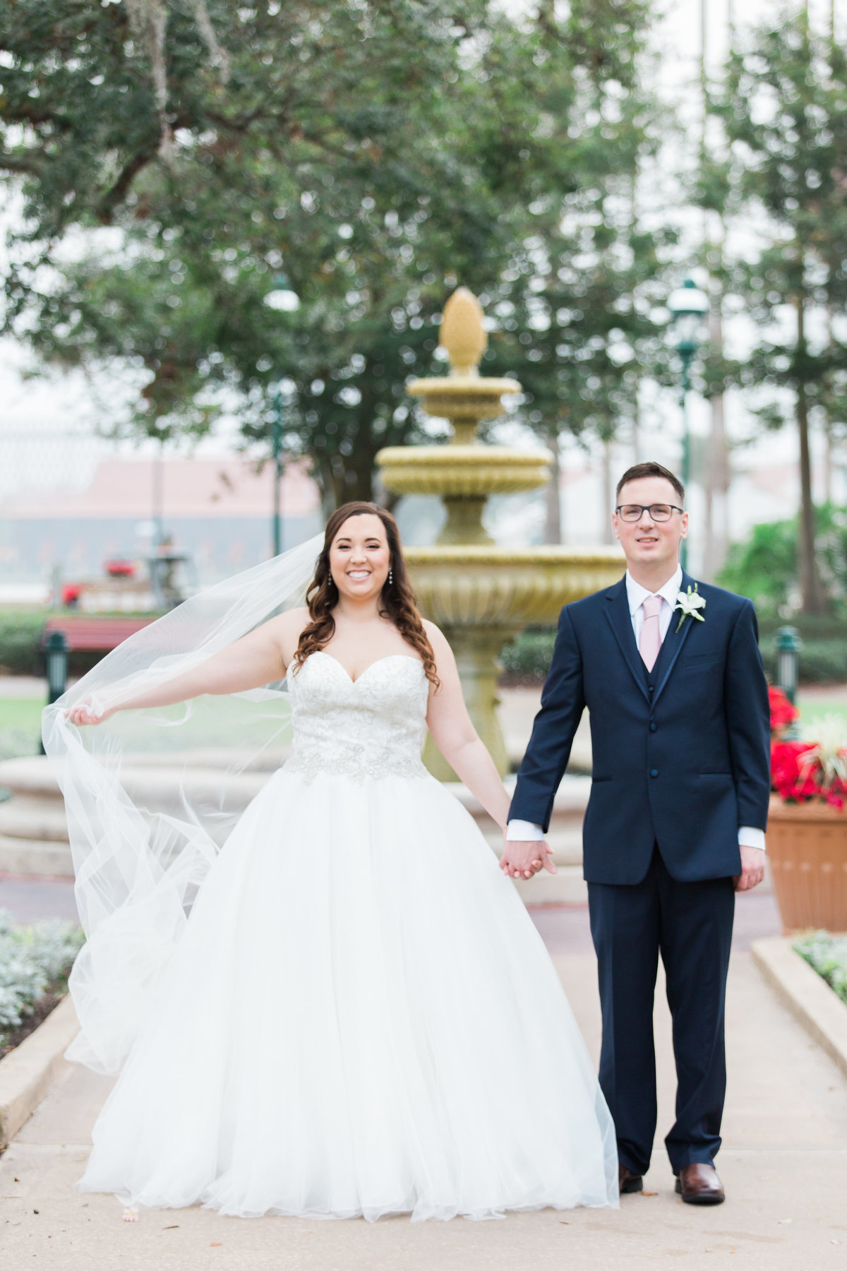 couple smiling for a wedding photo in Disney