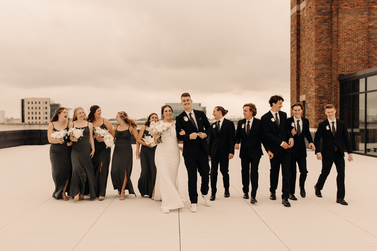 iowa wedding party group photos on a roof top in Cedar Rapids