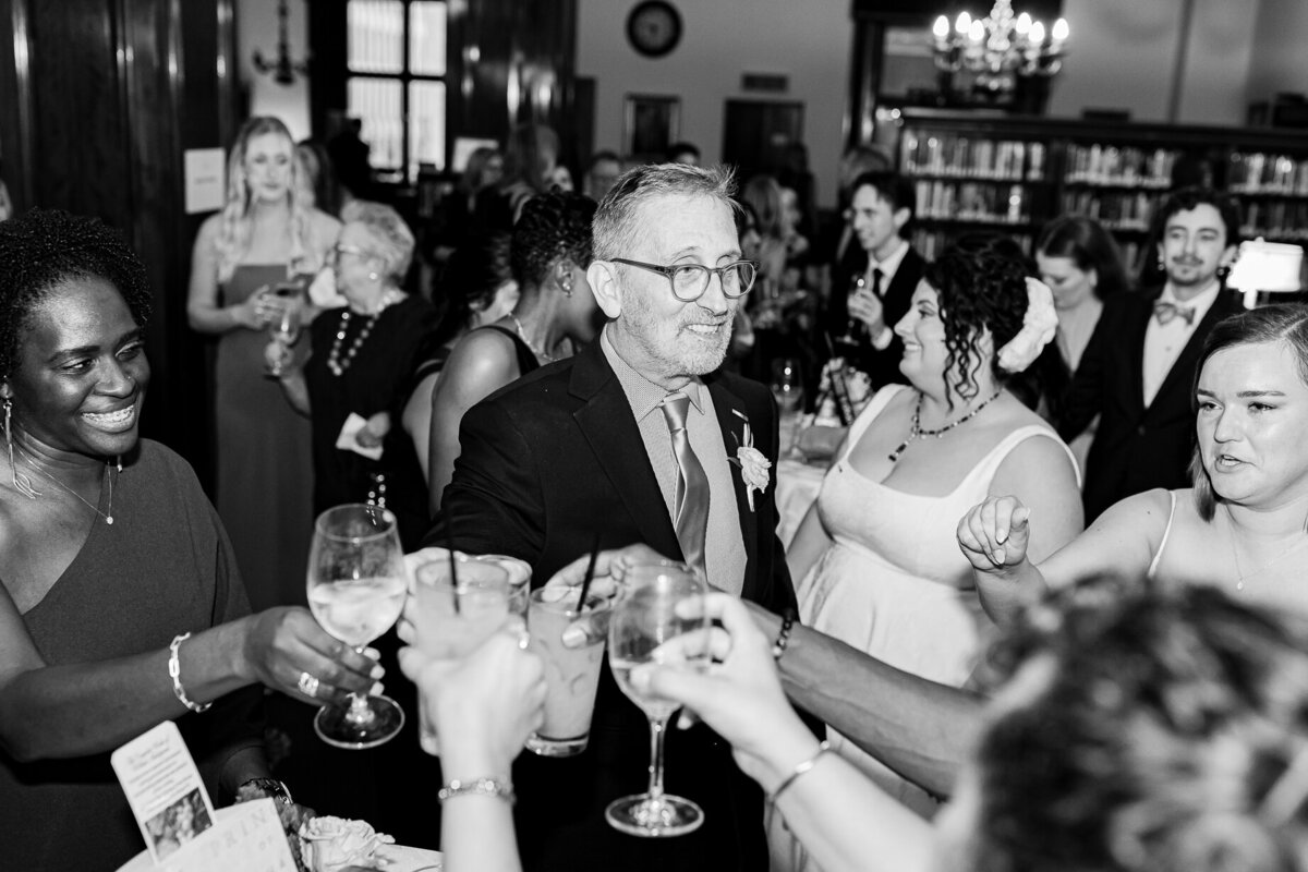 The father of one of the brides shares in a toast at the Union League Club Chicago