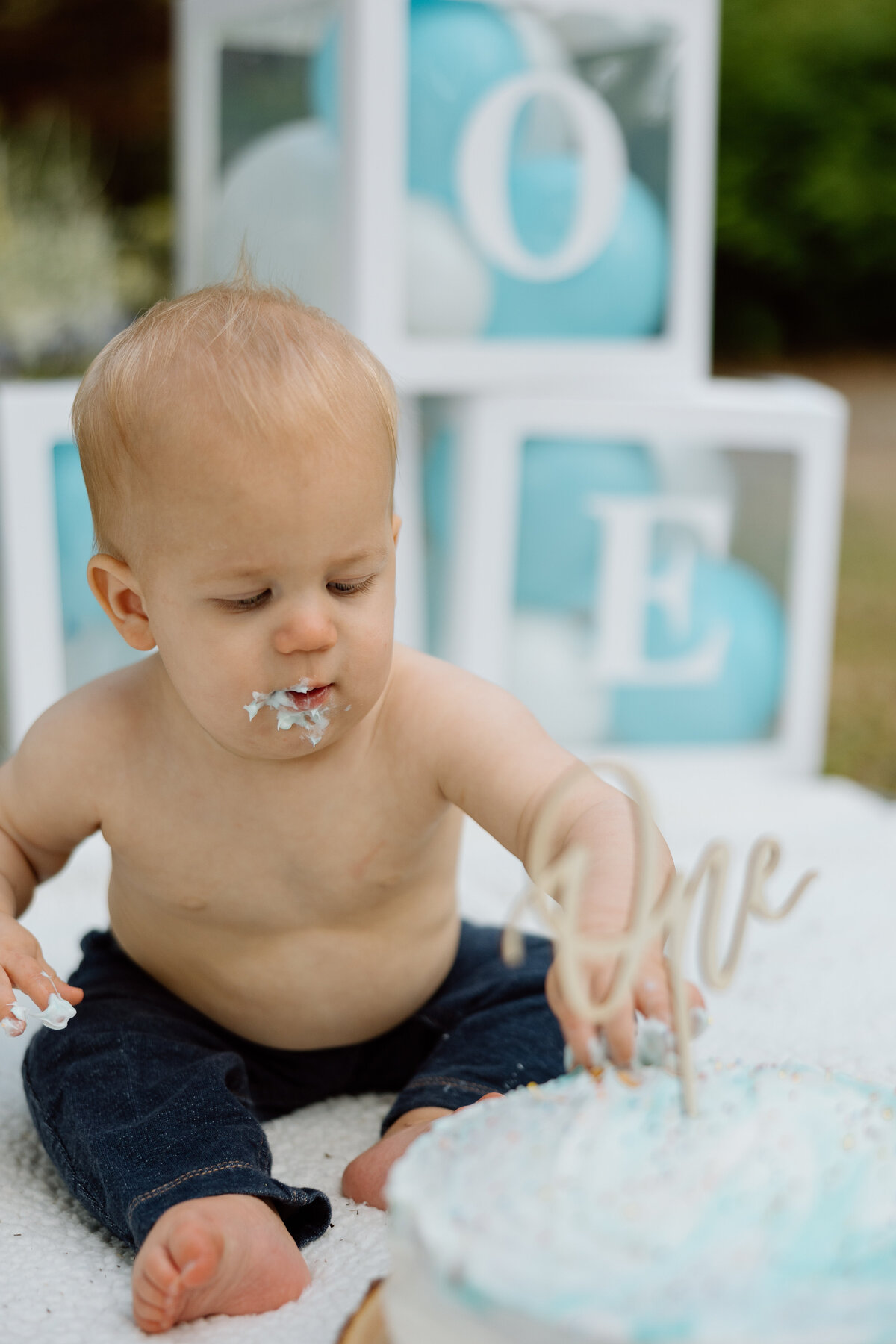 Baby's first birthday photoshoot with a smash cake