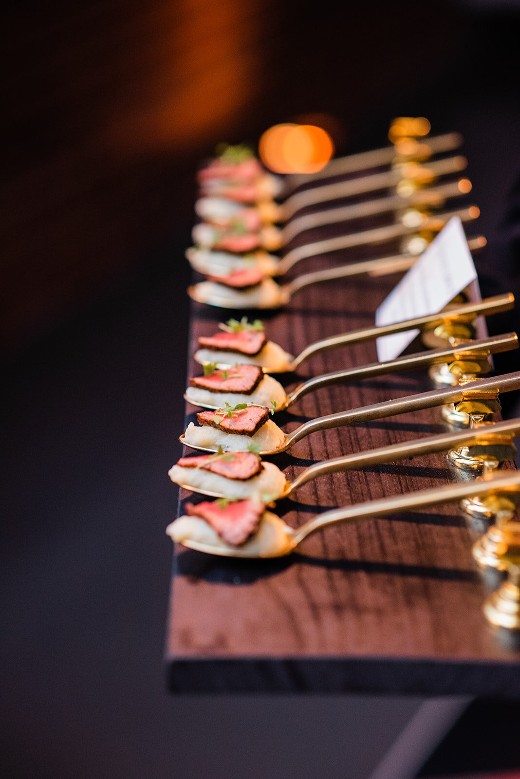 bleu cheese mashed potatoes and seared filet mignon bites on golden spoons at Willowbrook wedding venue in PIttsburgh