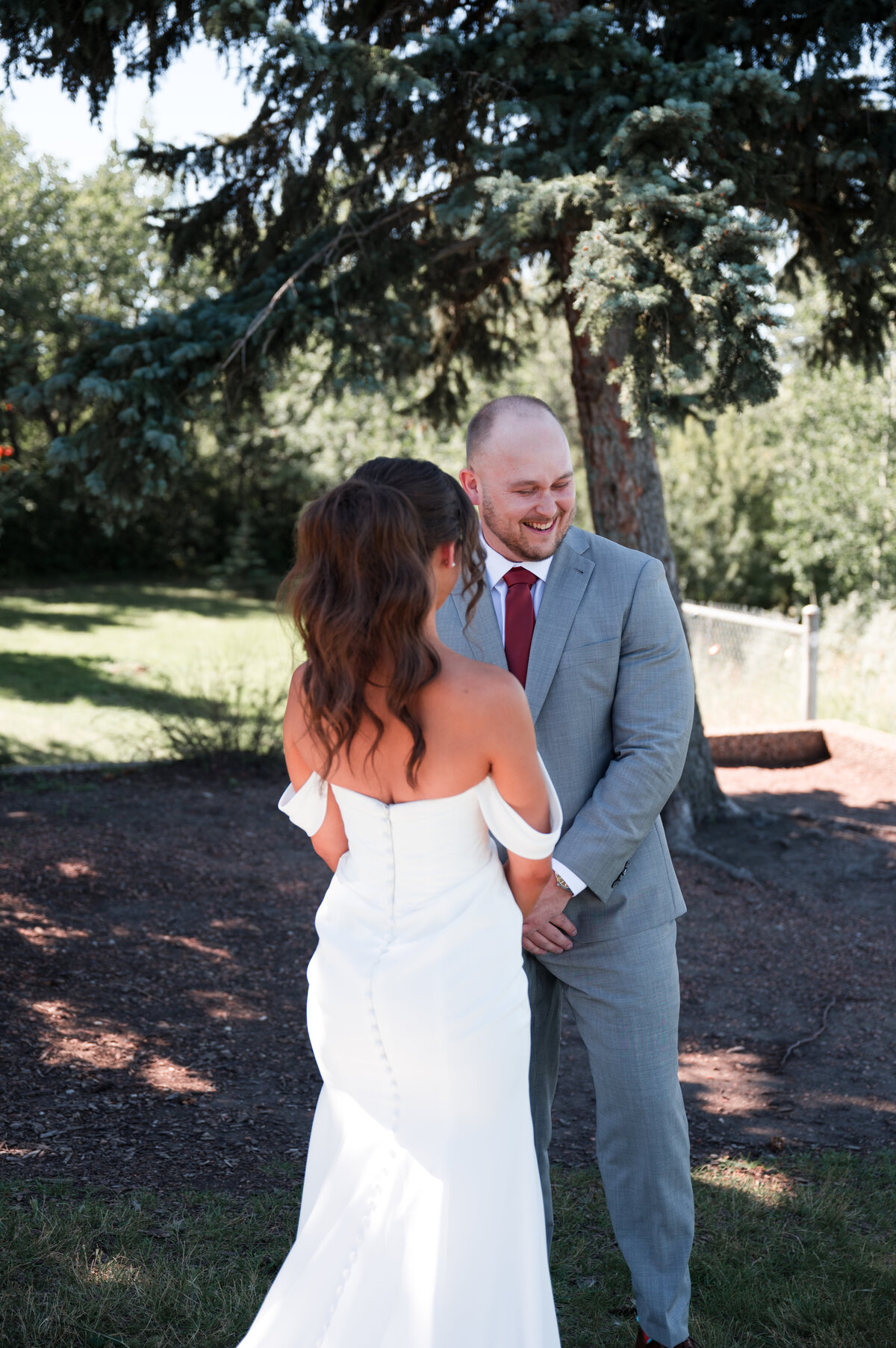 groom seeing his bride for the first time in emotional wedding photos