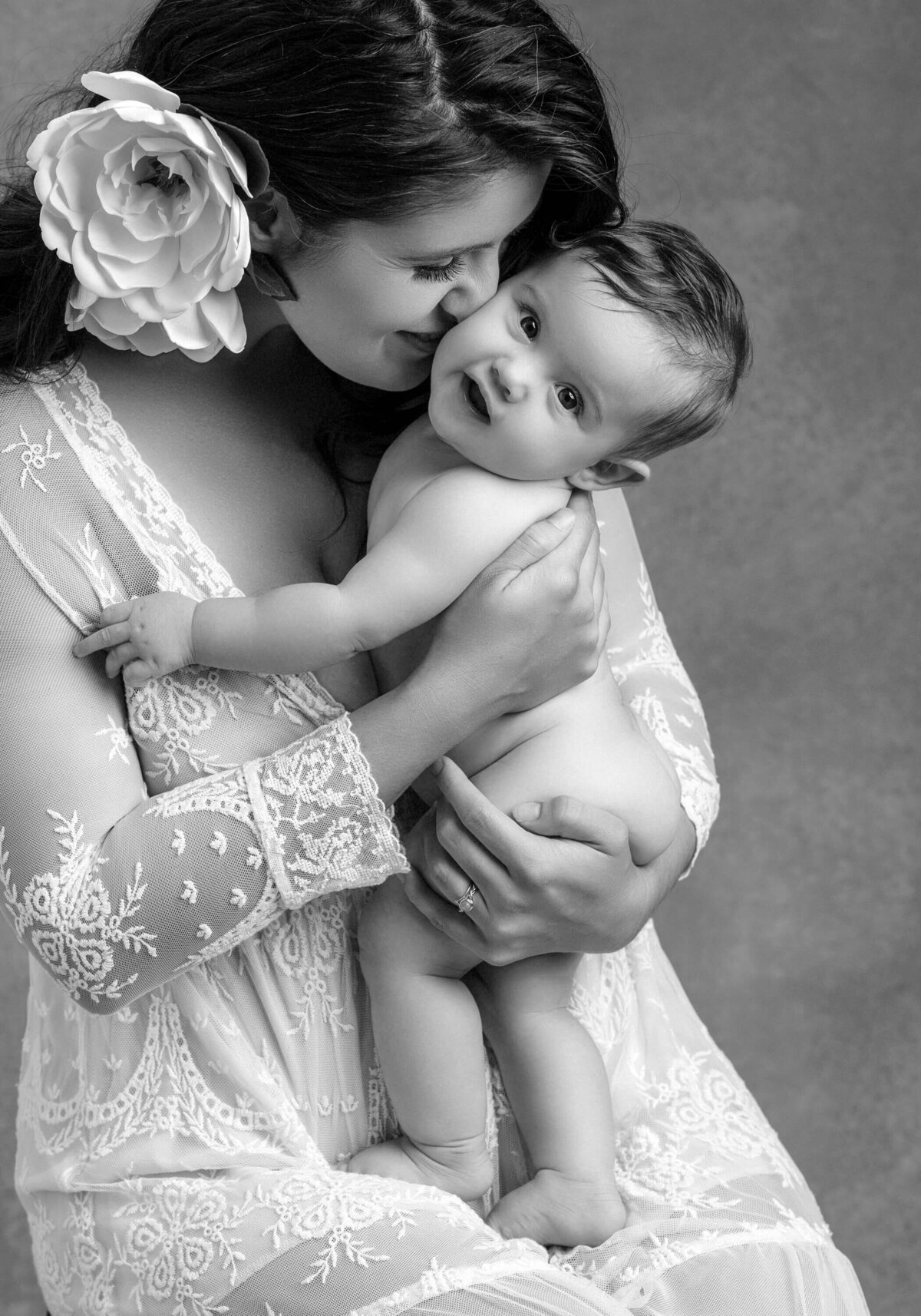 Tender mother and baby embrace.