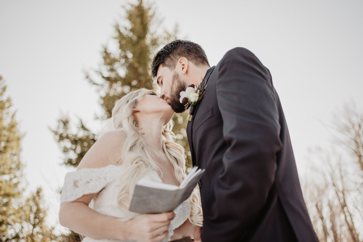 Jackson Hole Photographers capture groom kissing bride