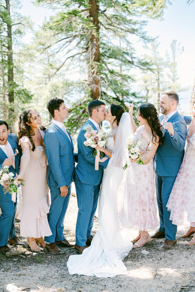 Wedding group laughing in Tahoe forest