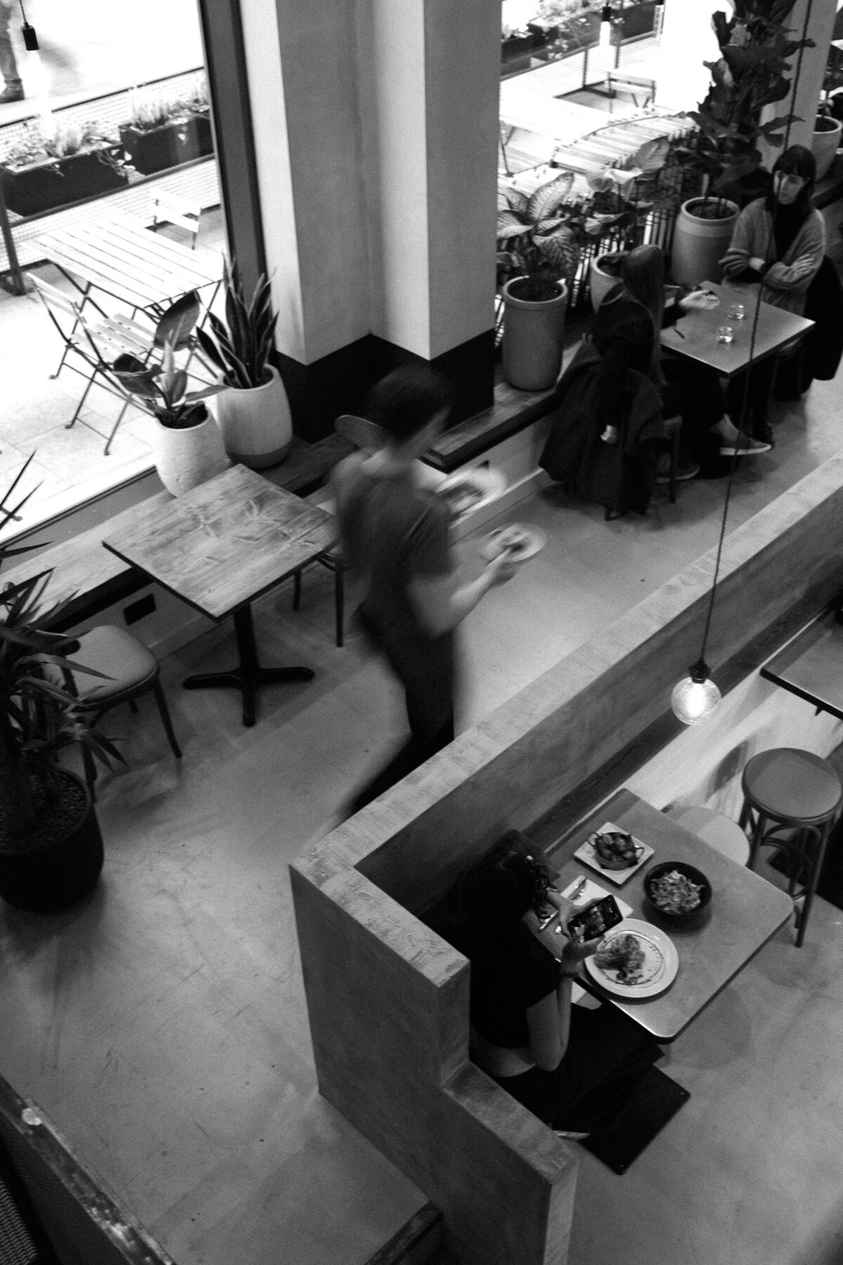 staff walking in a coffee shop.