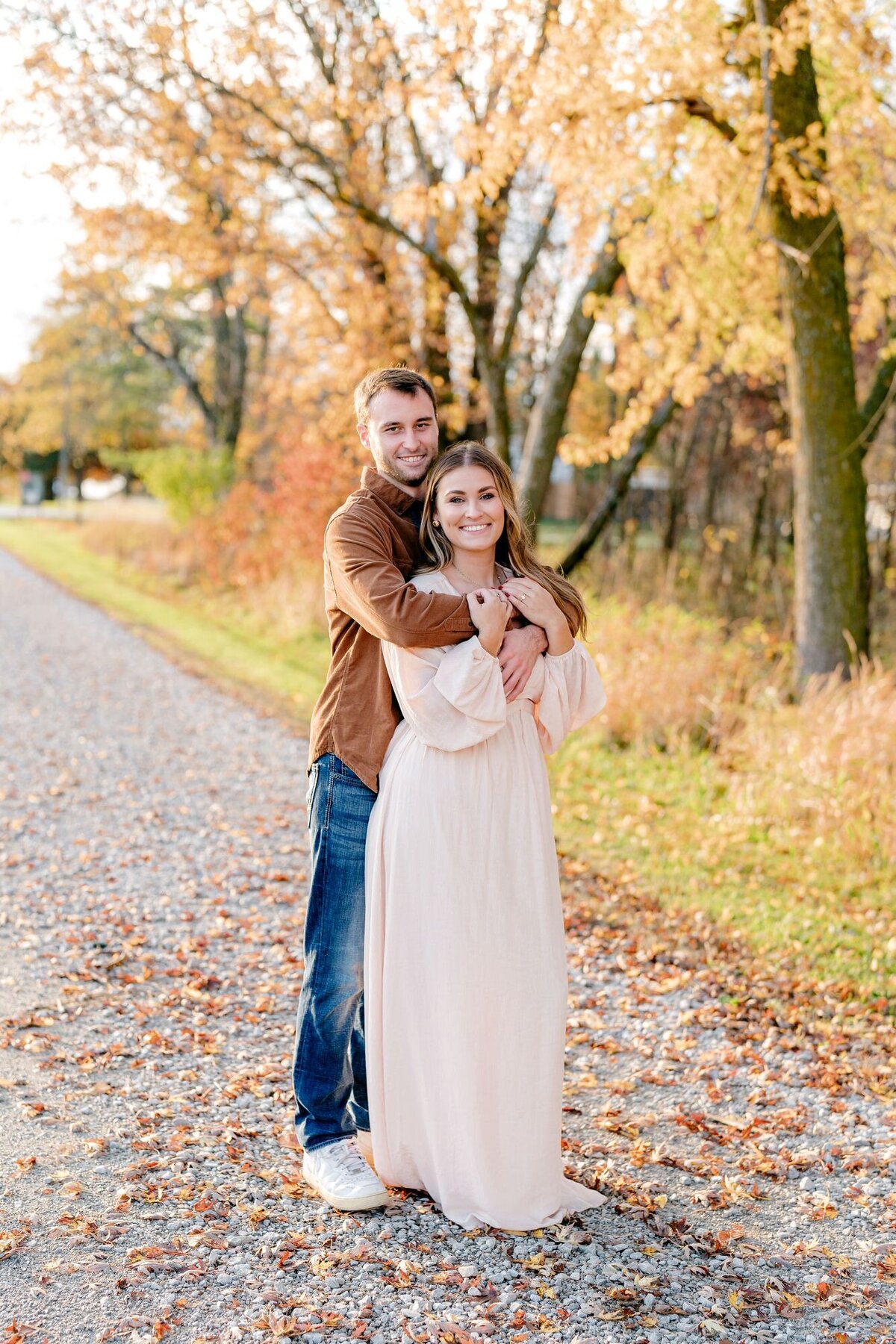 couple-embracing-eachother-fall-session