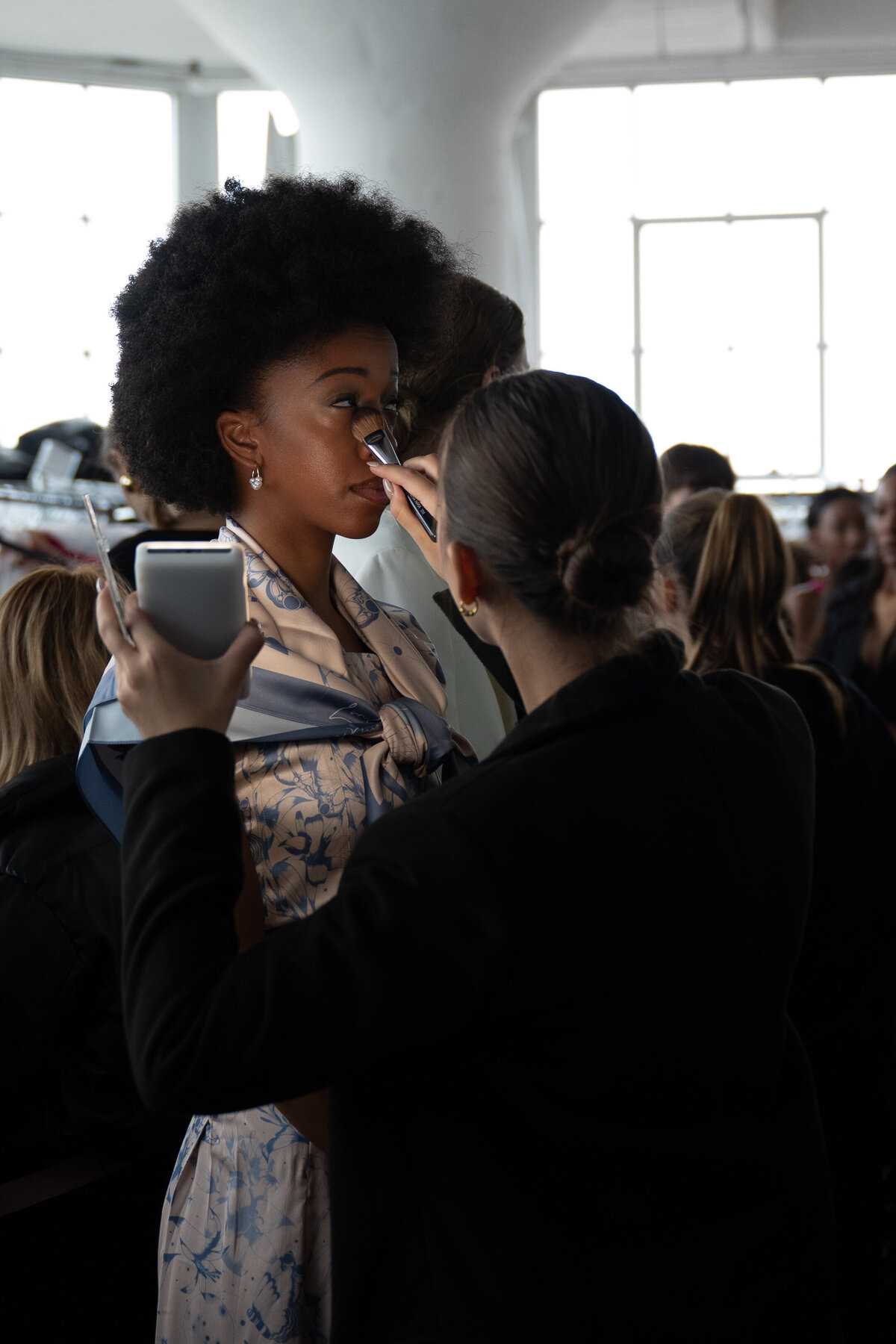 model getting makeup done