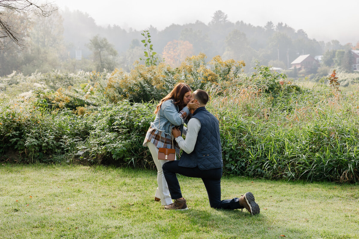 A surprise proposal surrounded by butterflies in Stowe, Vermont during summertime, capturing a magical and intimate moment outdoors