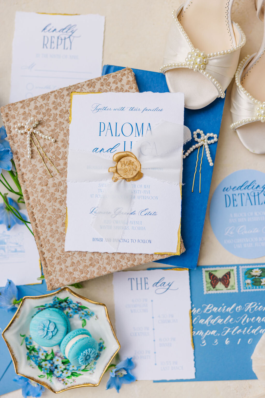 A beautifully styled wedding flat lay featuring elegant invitations, bridal shoes, and delicate accessories. This thoughtfully curated detail shot captures the essence of wedding day elegance, offering inspiration for brides looking to add a personal and luxurious touch to their celebration.