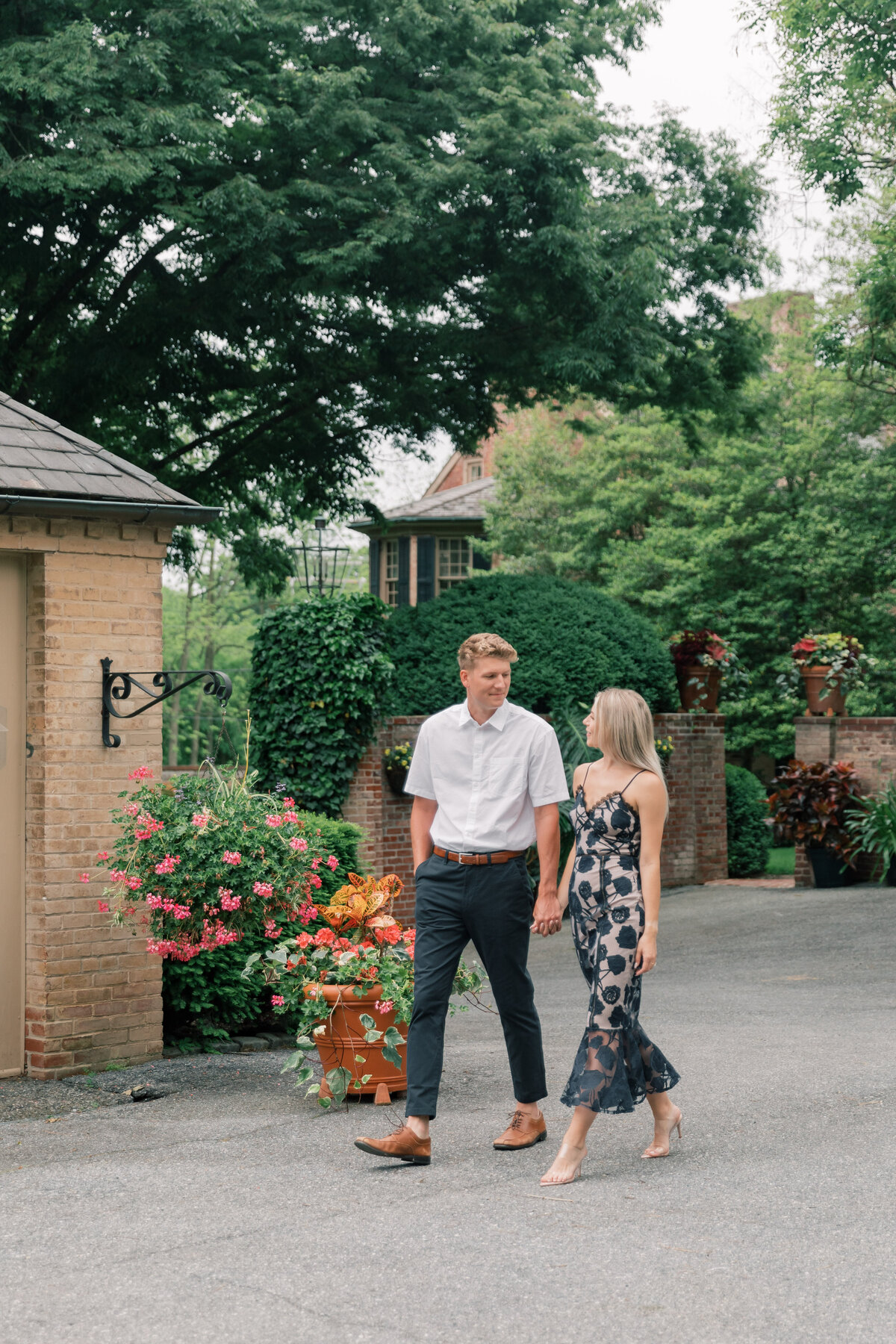Couple walking through Conestoga House for engagement session