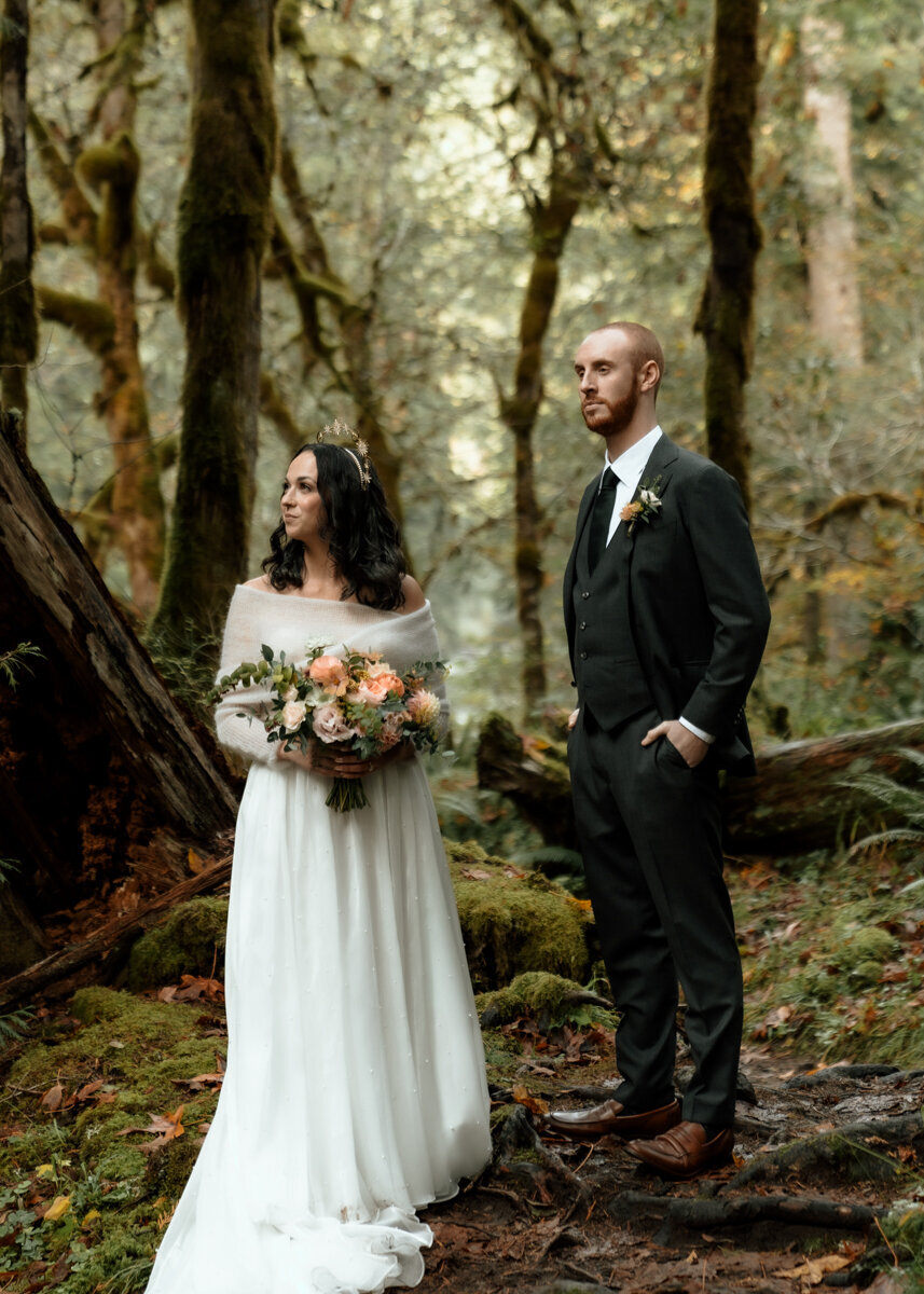 Newly married couple taking editorial cinematic portraits after their marriage ceremony in Mount Hood, Oregon forest