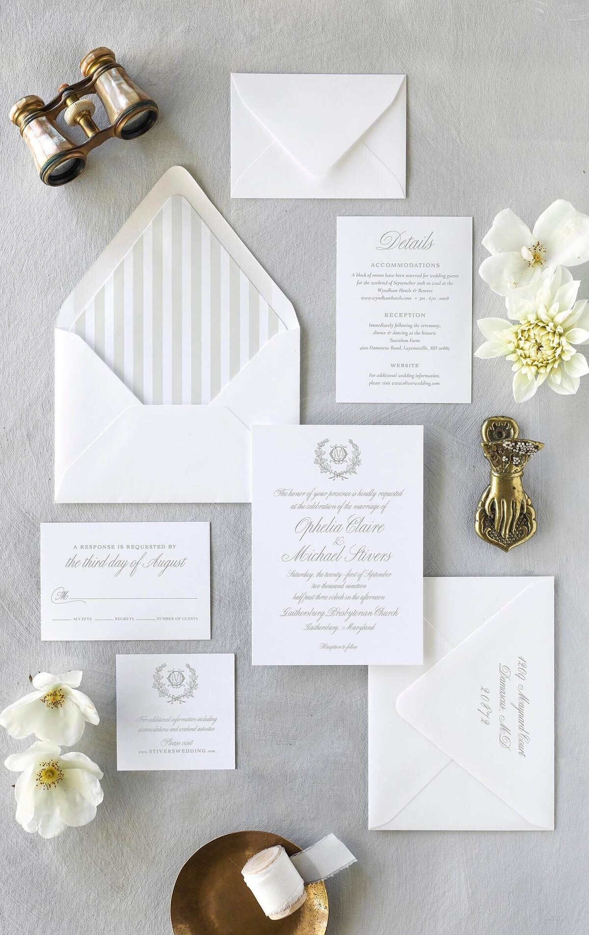 Classic wedding invitation suite with white florals and brass details