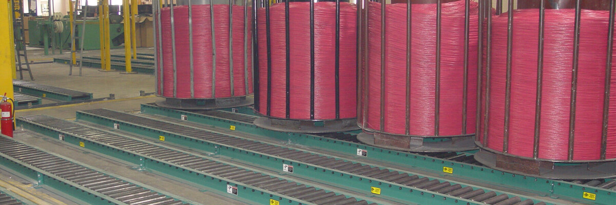 roller belt system for manufacturing facility