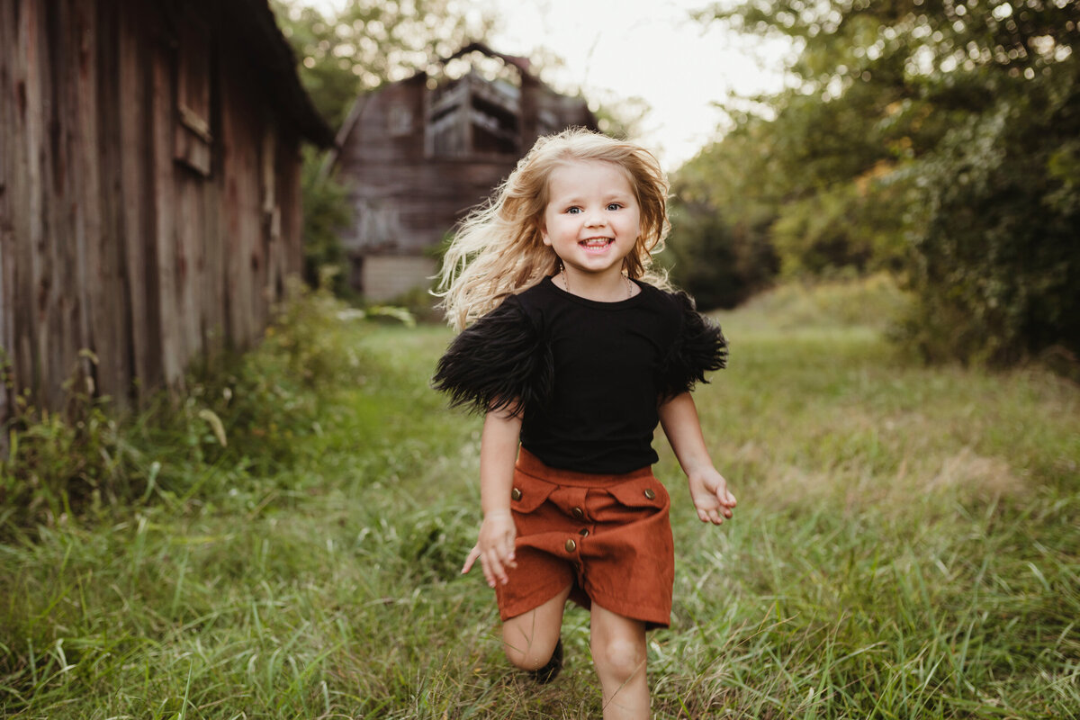 little girl running and smiling