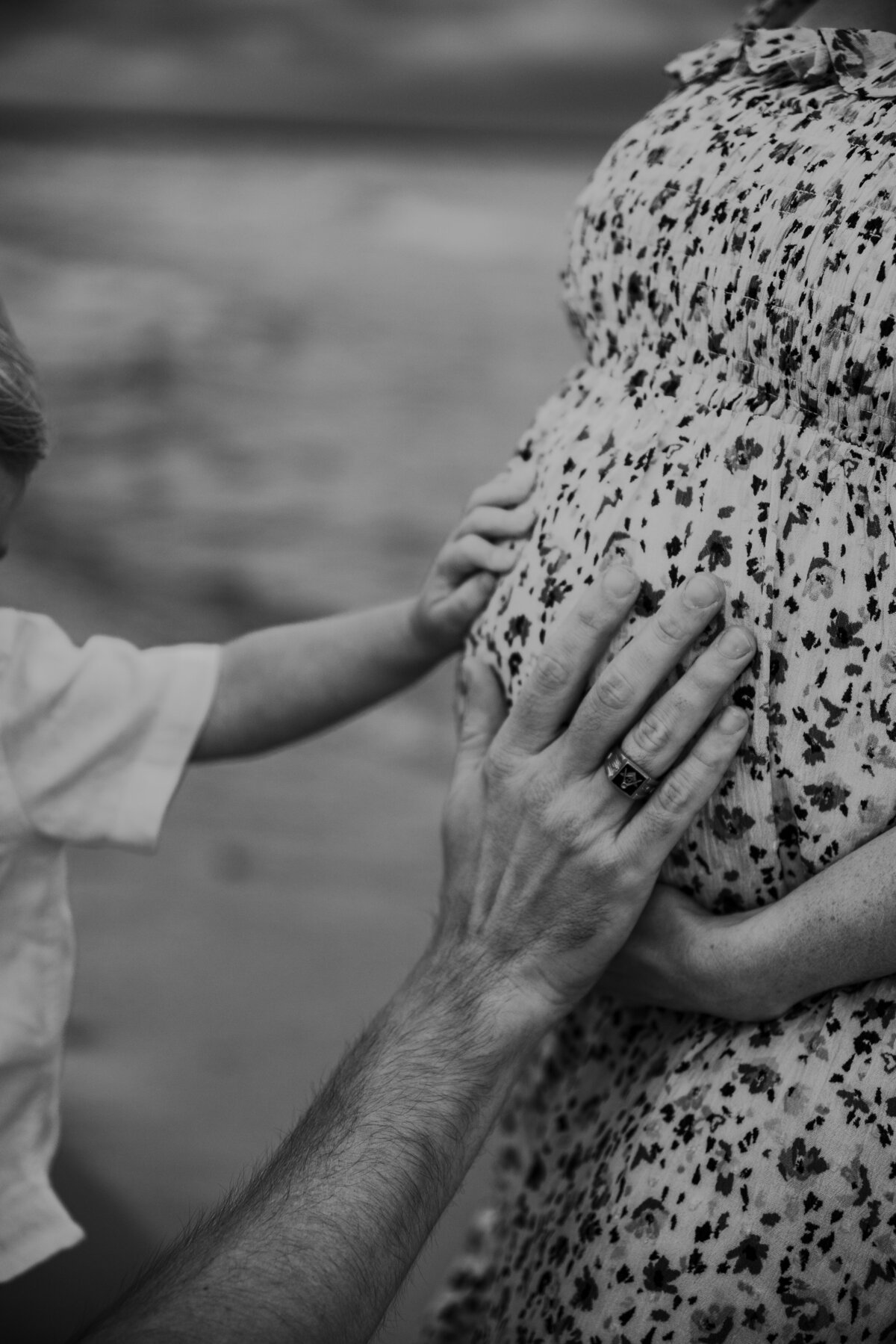 little hands touching moms belly in oswego ny