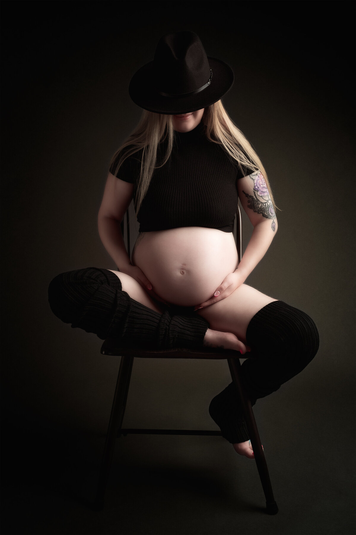 Studio maternity portrait with dark tones and dramatic lighting | Meraki Photographic Creations Paris Ontario