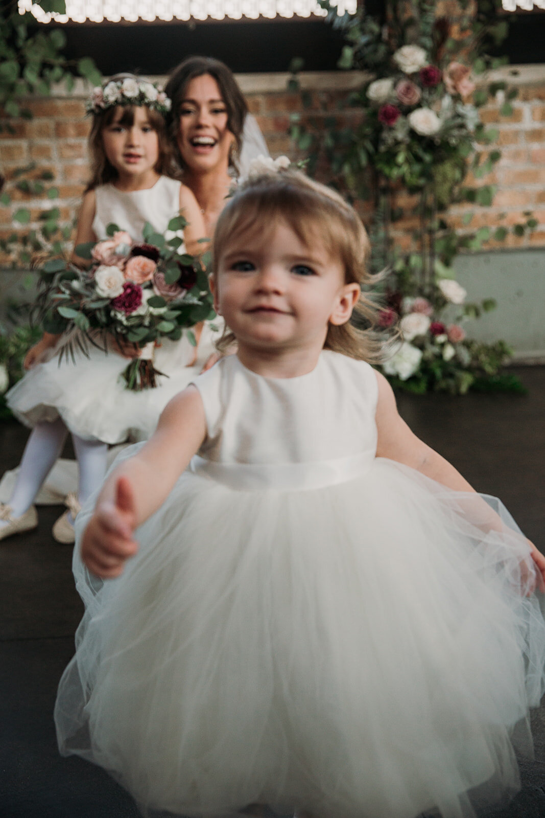 Flower girl and bride at wedding ceremony