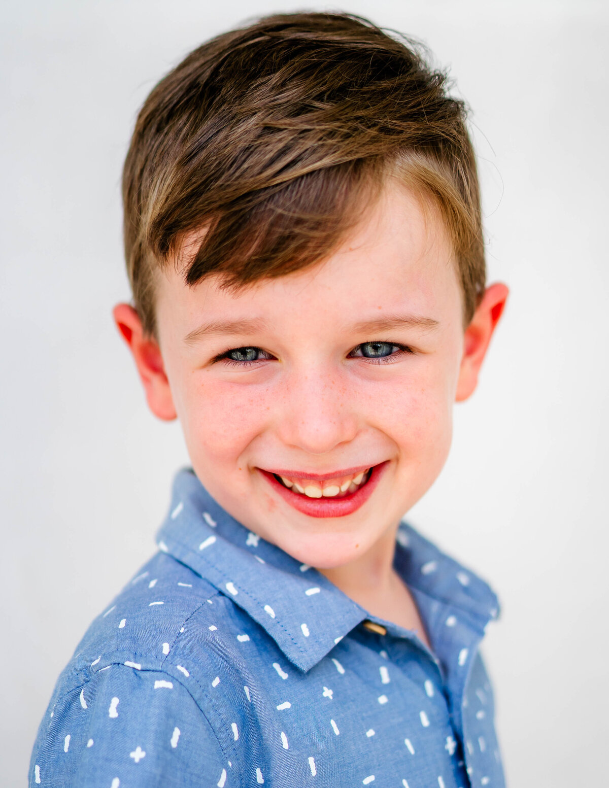 Child dressed formally for a refined fine art school portrait
