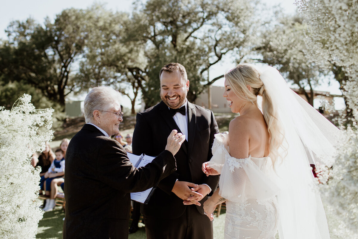 Funny ceremony moment at Lazy S Hacienda in Weatherford Texas. Captured by Fort Worth Wedding Photographer, Megan Christine Studio