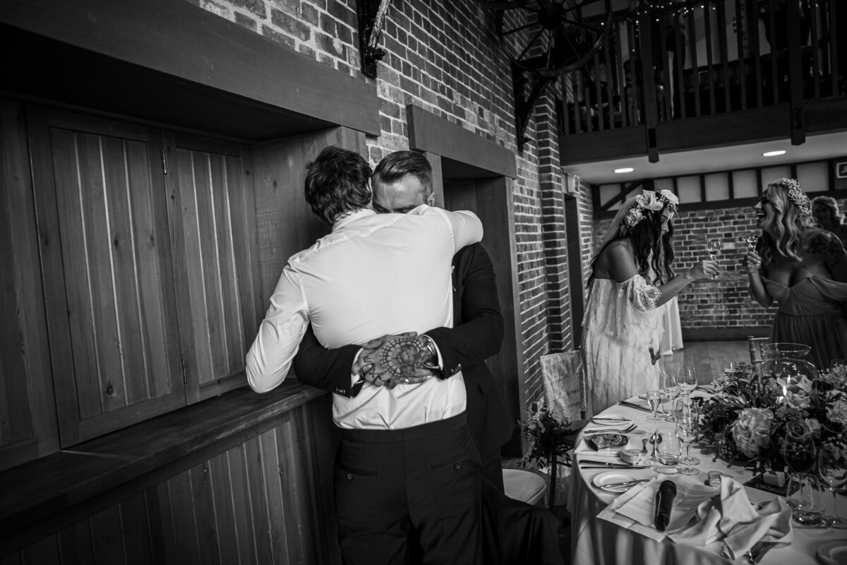 Best man and Groom hug after the speeches