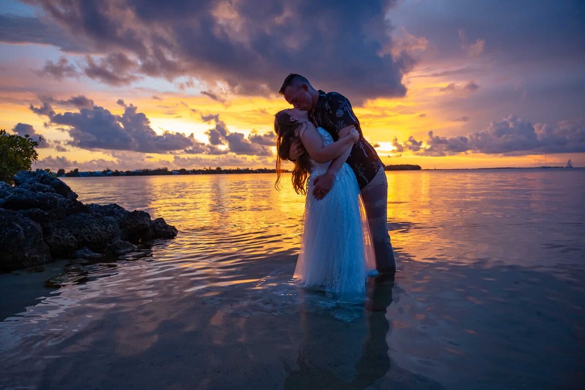Bride and groom kissing at the end of the night in Key Largo captured by Key Largo Wedding photographers