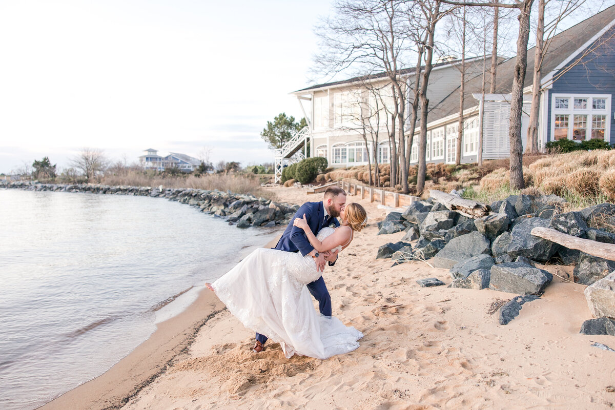 couple dip kiss at beach sunset chesapeake bay beach club