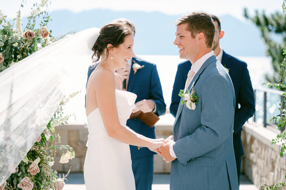 Couple exchanging vows by Tahoe lake.