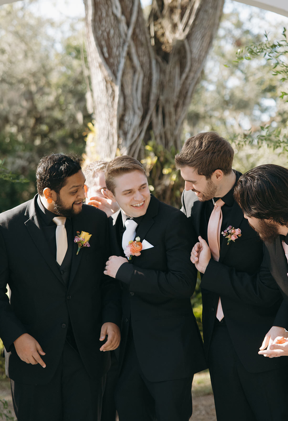 Candid moment with groomsmen before the ceremony at Uliana Estate in Lakeland Florida.