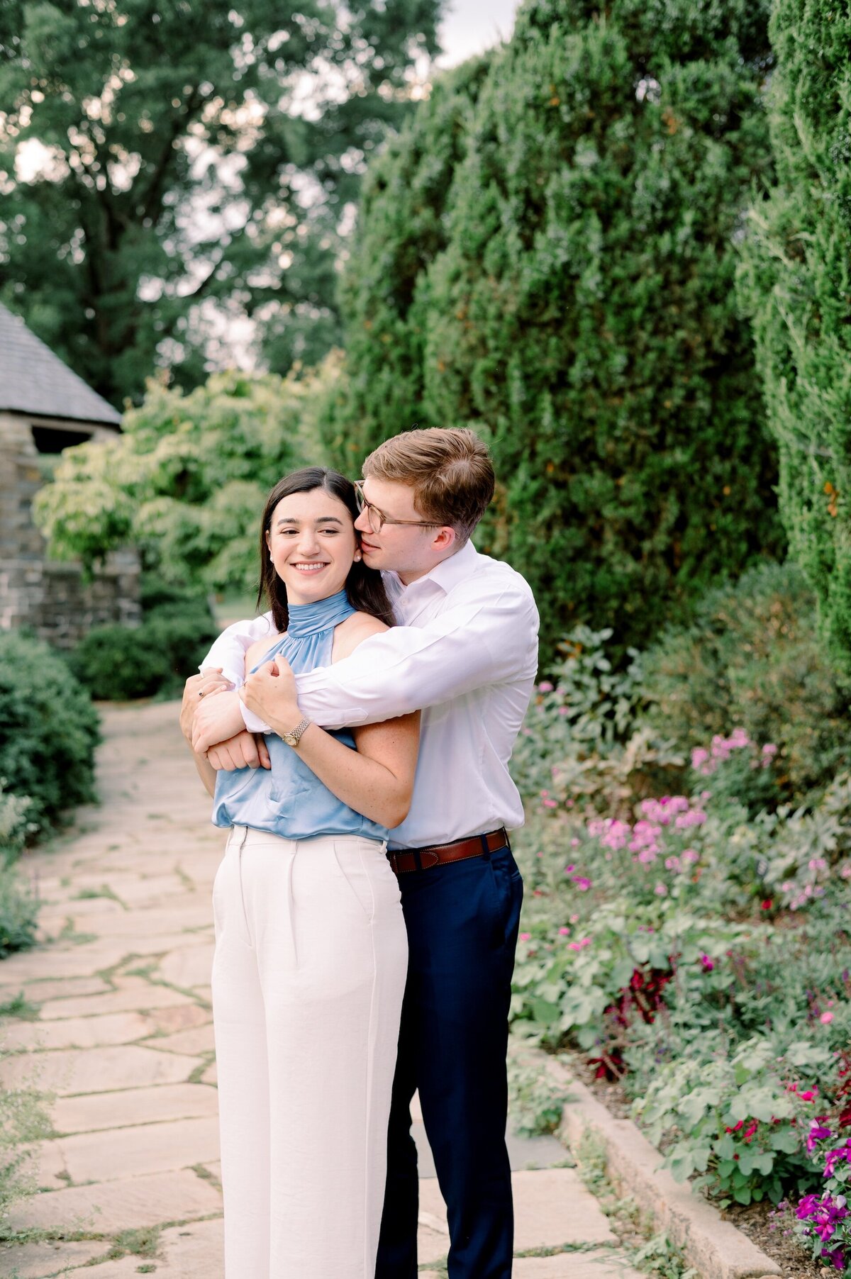 a man wrapping his arms around his fiance