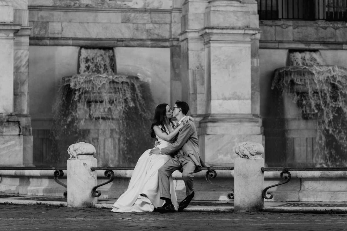 Bride and groom in cozy Roman alley looking at each other.