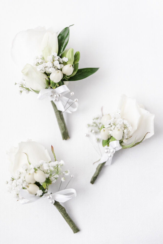 a flat lay of white flower bouquets