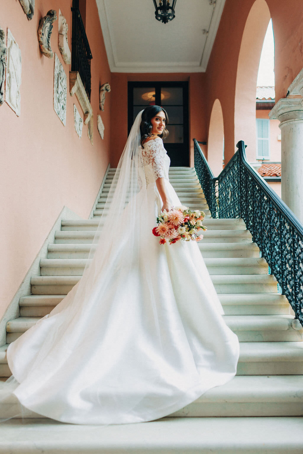 bride-on-strairs-bridal-gown-bouquet-details