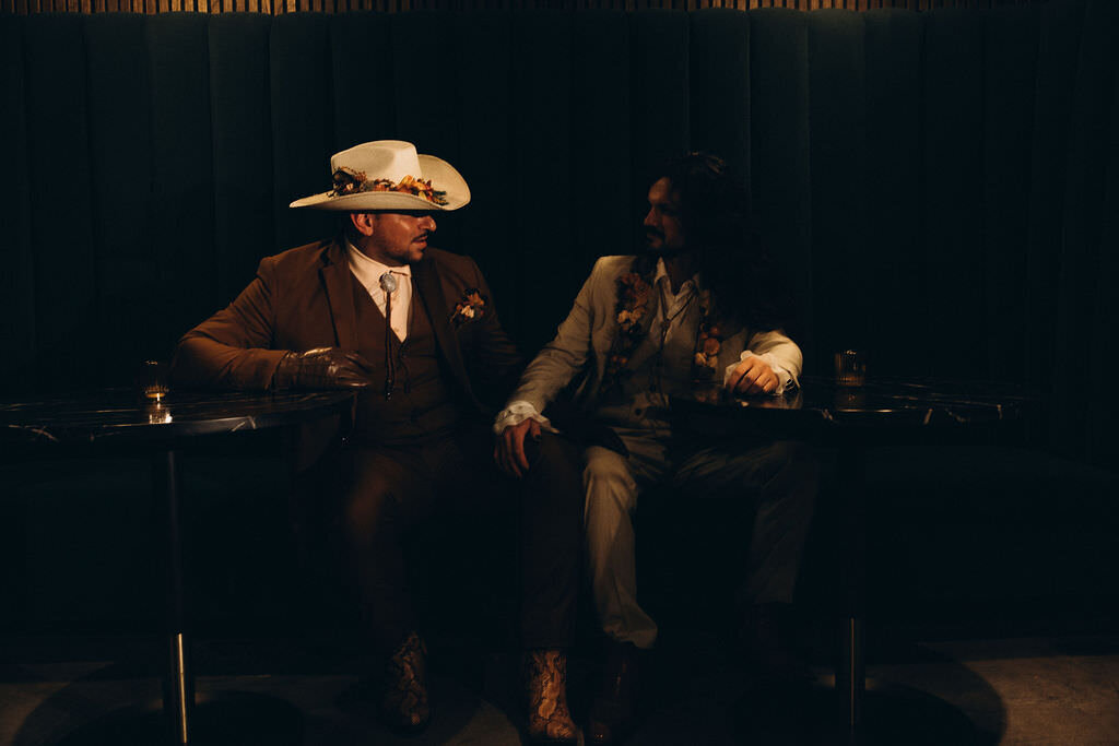 A couple sitting in a booth together.