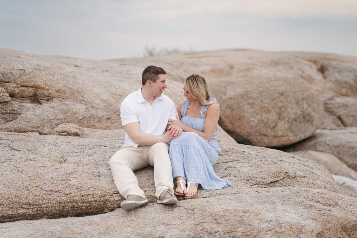Natural and timeless engagement photos at the beach, capturing genuine moments by the ocean.