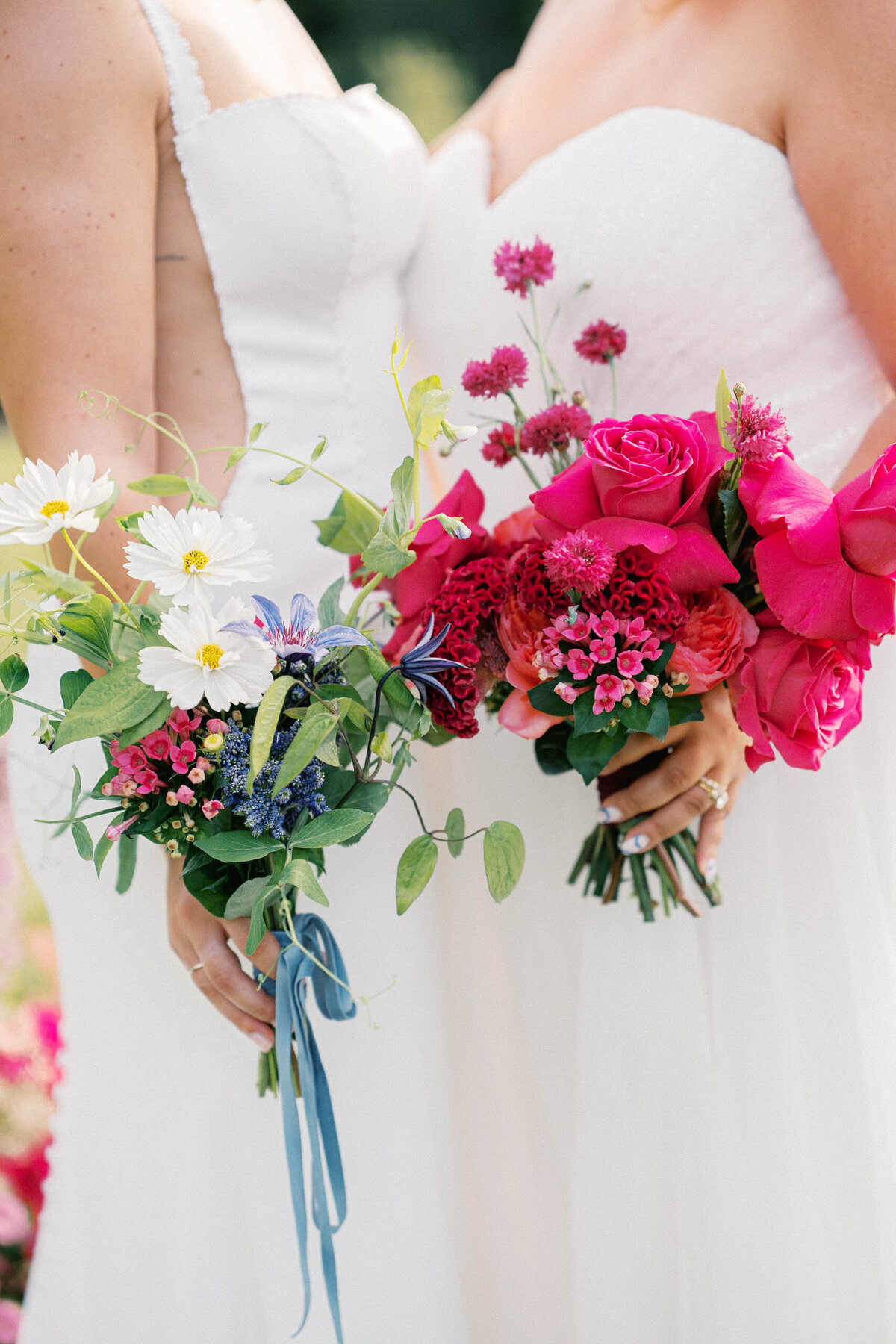 brides hold colorful and bold bouqets taken by boston documentary wedding photographer
