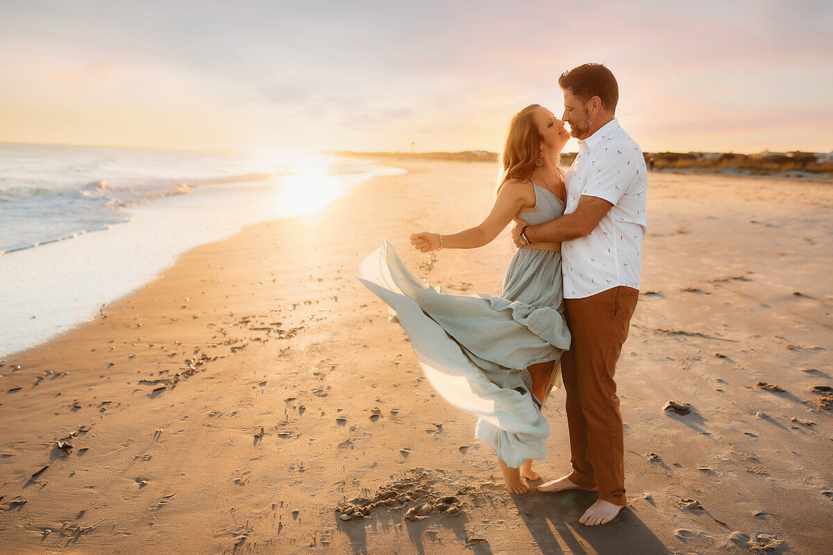Couple kisses during Family Pictures in Isle of Palms, South Carolina.
