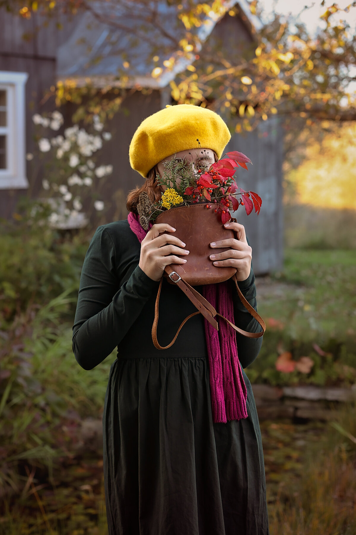Girl in a green dress smelling flowers|Farm in Quebec|Fall photo session|Yuliia Terziian Photography