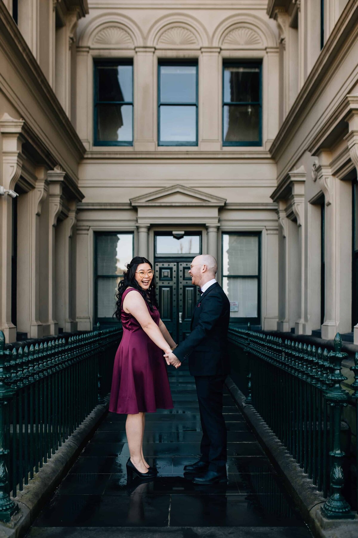 Wedding photography at Treasury Place Melbourne. Couple holding hands in front of heritage building, And So I Don't Forget Photography