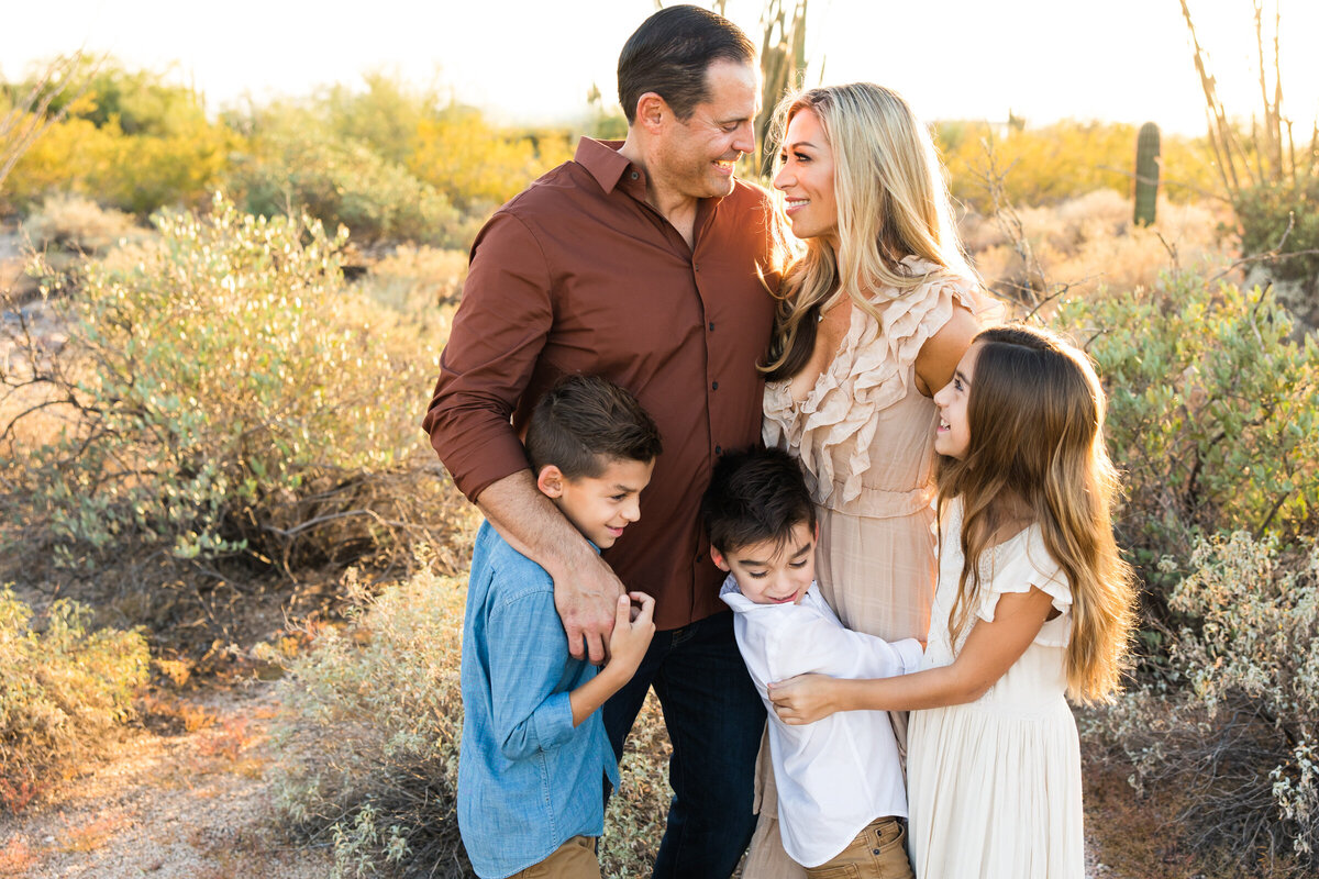 family smiling together in Scottsdale desert