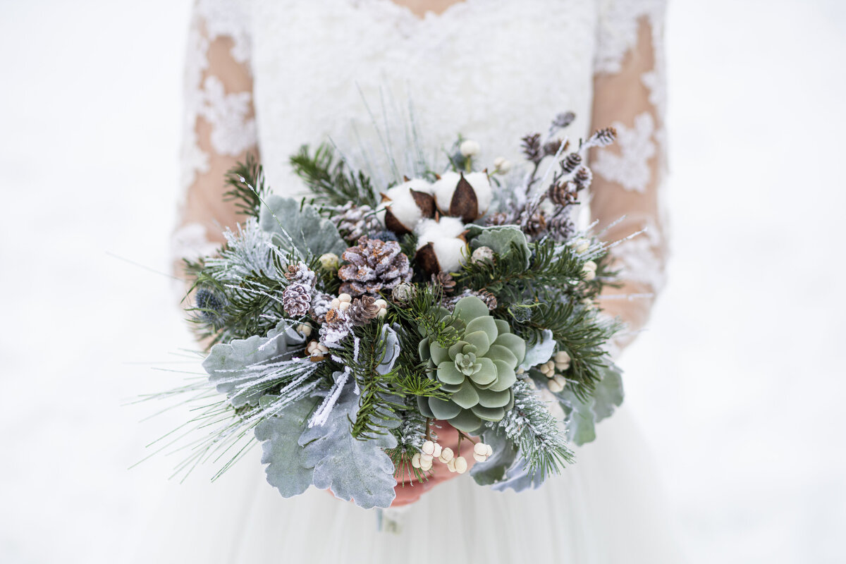 Wedding flowers with pine,  pinecones, cotton, succulents