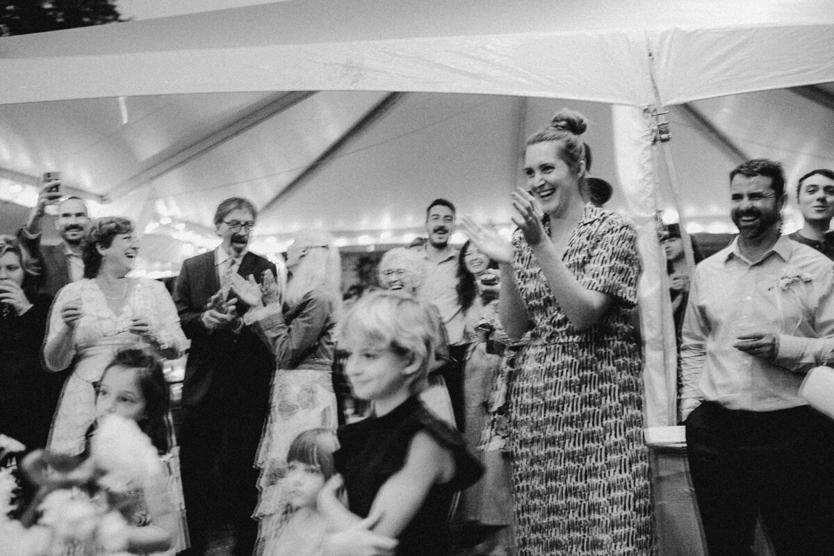 Wedding guests clapping at Umlauf Sculpture Garden wedding, Austin