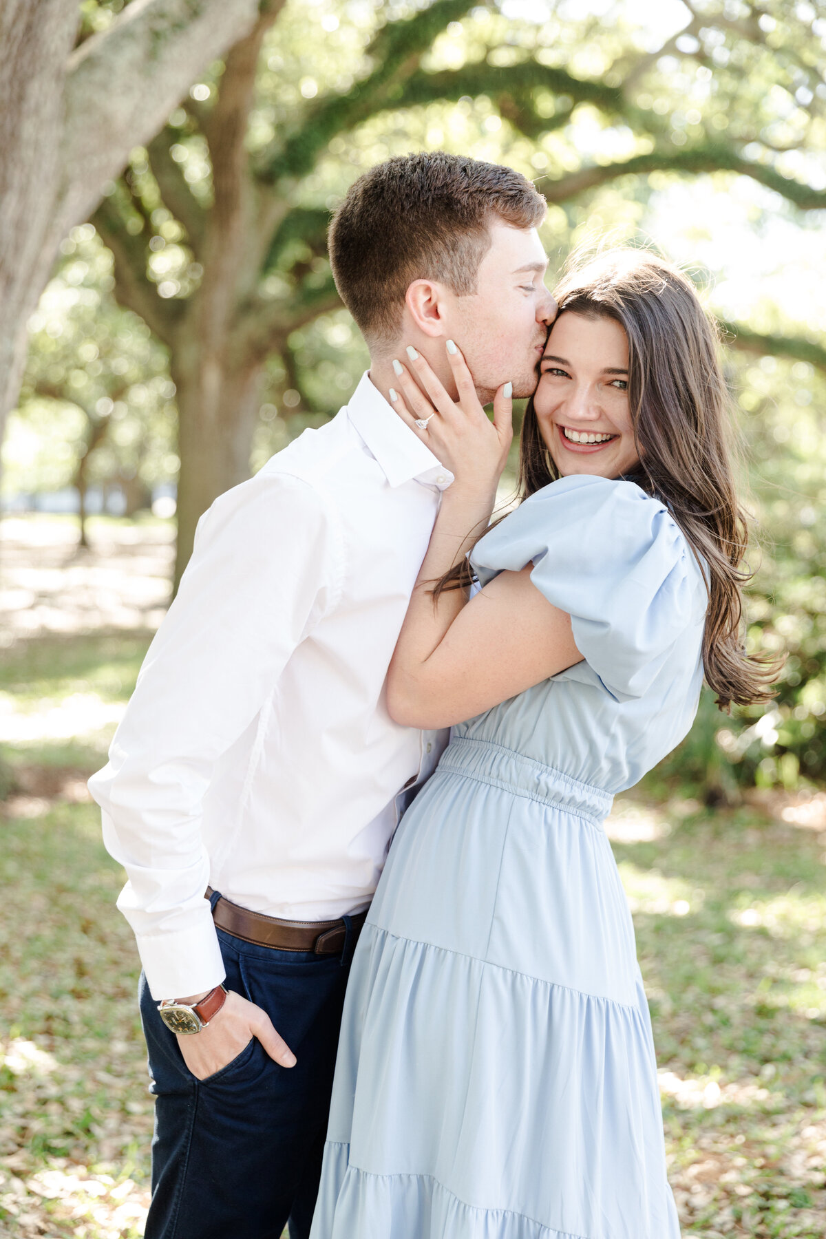 Guy kissing girl in White Point Garden - Charleston, SC